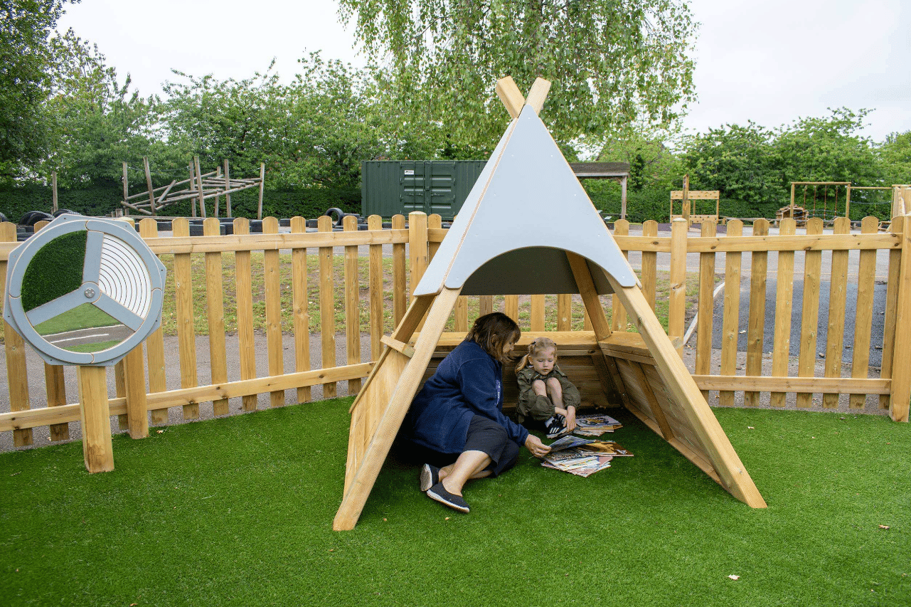 A Pentagon Play bespoke School Playground Scheme with children playing on the playground