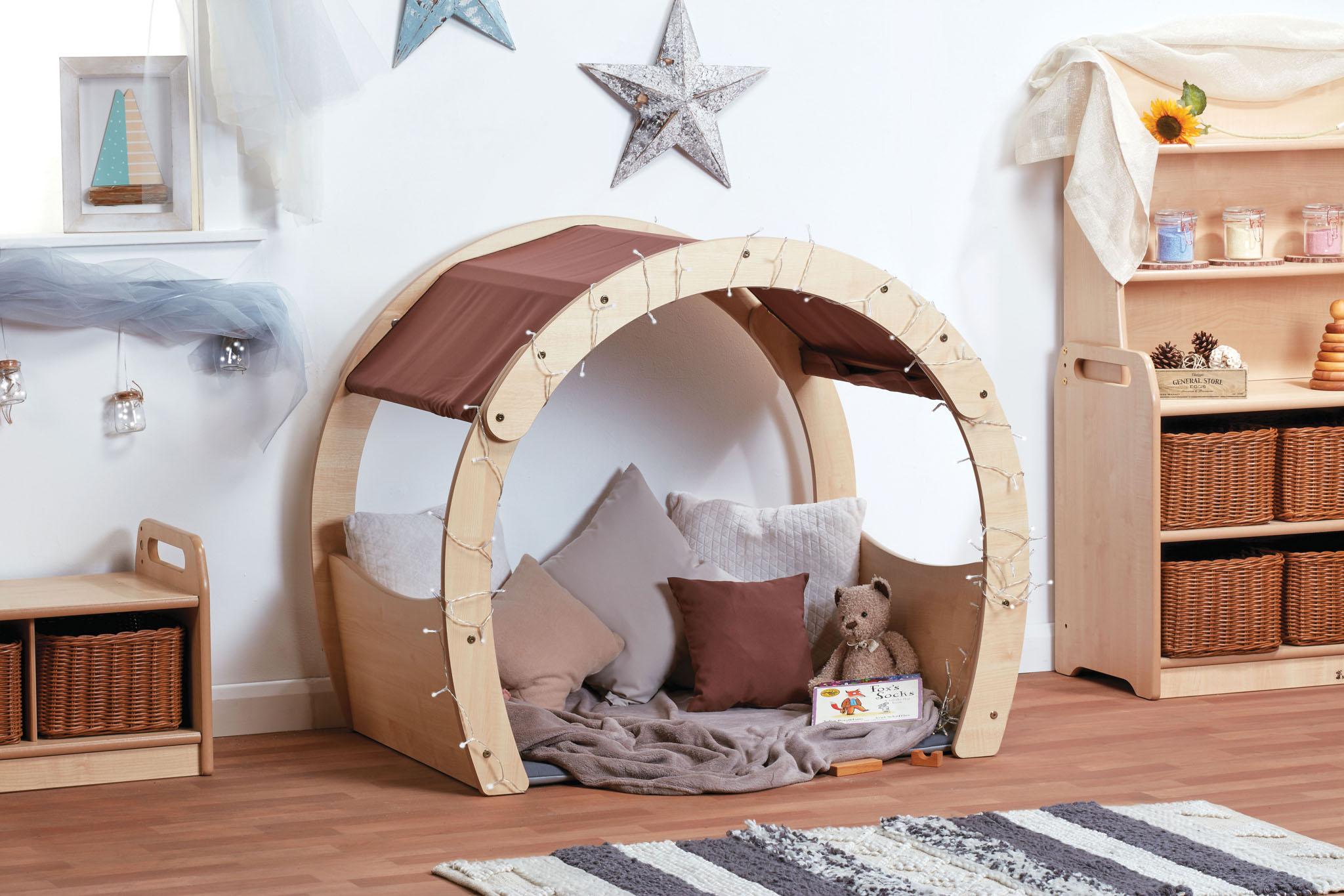 A small wooden Cosy Cove arch in a classroom setting.