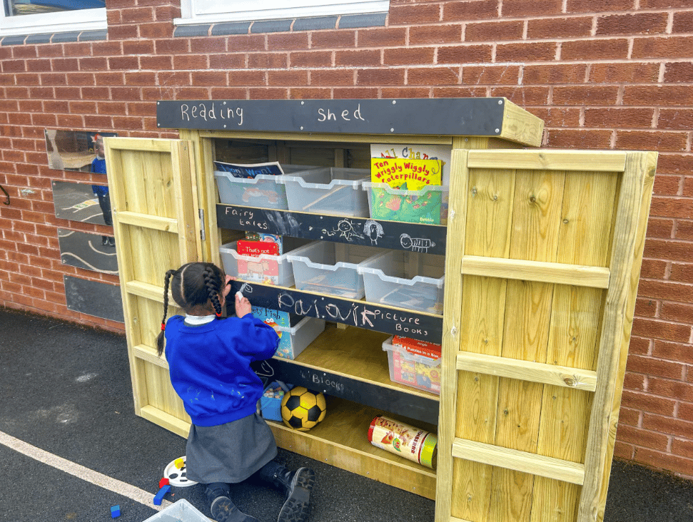 A Pentagon Play bespoke School Playground Scheme with children playing on the playground