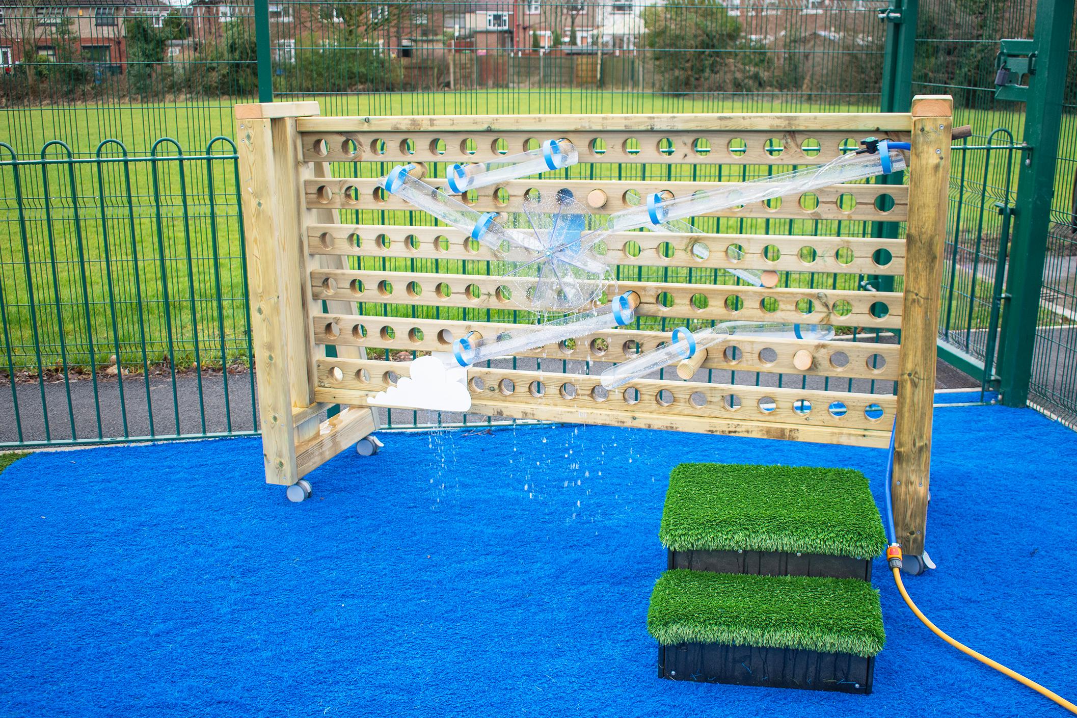 The movable water wall product shot along with the artificial grass topped steps