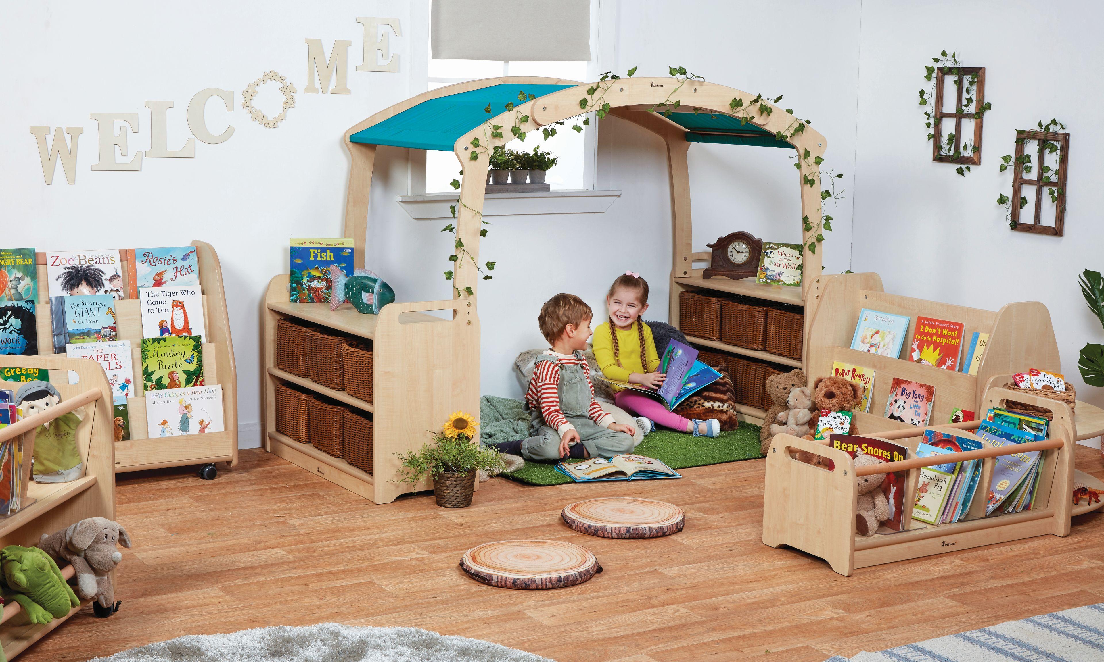A studio photo of a reading den nestled into the corner of a classroom.